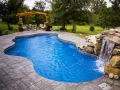 Freeform Swimming Pool with Rock Waterfall and Pergola