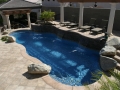 Freeform Swimming Pool with Deck Jets, Pergola and Sheer Descent