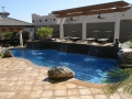 Freeform Swimming Pool with Deck Jets, Pergola and Sheer Descent